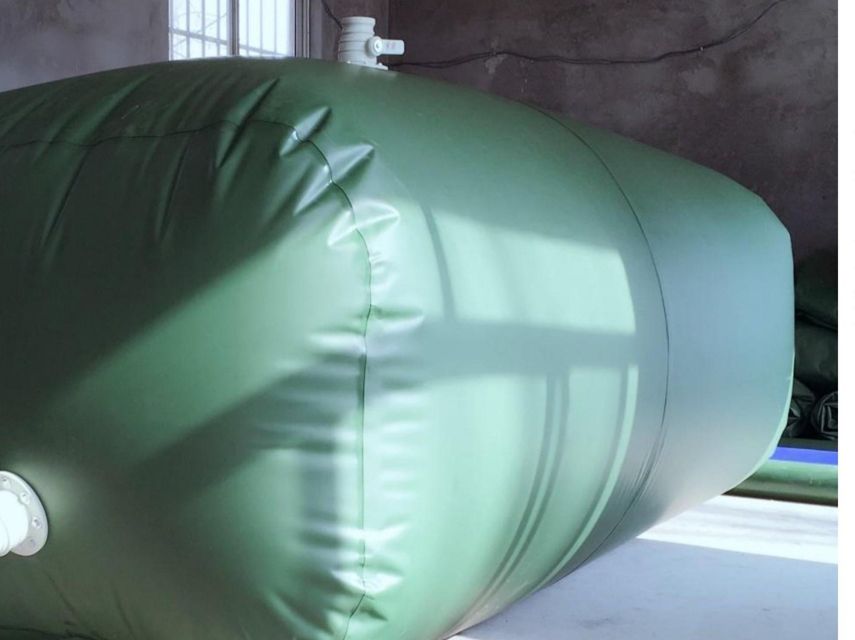 Actual green flexible water bladder shown in the supplied product catalogue