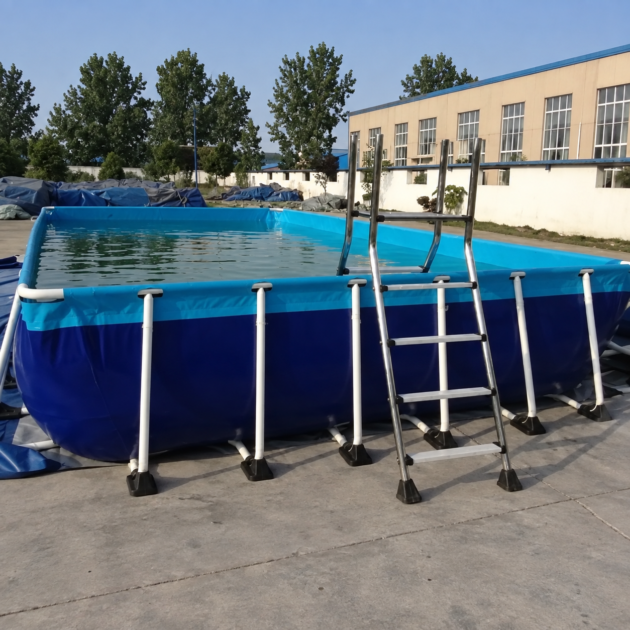 Extended square presentation based on the supplied photo of a blue supported pool with water and access ladder